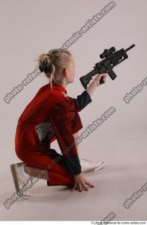 DENISA KNEELING POSE WITH GUN